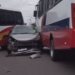 Engavetamento com ônibus de rota e carro termina com muro destruído em Manaus; vídeo